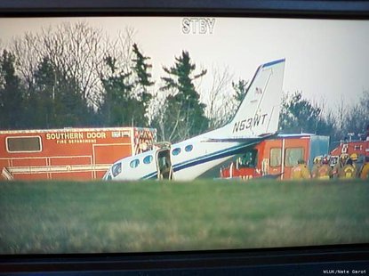 A twin-engine Cessna plane lands after 80-year-old woman is forced to fly plane after husband pilot suffers a medical emergency near Sturgeon Bay. (Photo courtesy of Fox 11 WLUK-TV) A twin-engine Cessna plane lands after 80-year-old woman is forced to fly plane after husband pilot suffers a medical emergency near Sturgeon Bay. (Photo courtesy of Fox 11 WLUK-TV)