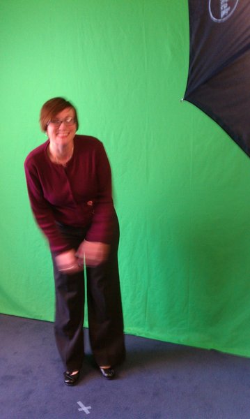 Nikki goofing off in front of the green screen