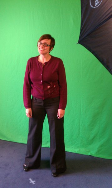Nikki goofing off in front of the green screen