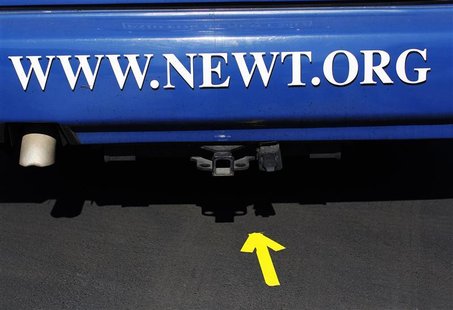An arrow points to the back of U.S. Republican presidential candidate and former Speaker of the House Newt Gingrich's campaign bus during a An arrow points to the back of U.S. Republican presidential candidate and former Speaker of the House Newt Gingrich's campaign bus during a