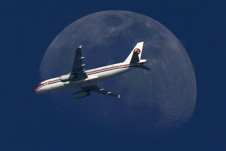 A China Eastern Airlines passenger jet passes in front of the moon over Shanghai in this May 13, 2011 file photograph. REUTERS/Aly Song/File A China Eastern Airlines passenger jet passes in front of the moon over Shanghai in this May 13, 2011 file photograph. REUTERS/Aly Song/File