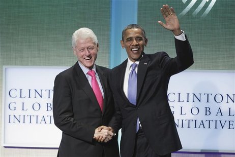 U.S. President Barack Obama (R) greets former U.S. President Bill Clinton after speaking during the Clinton Global Initiative in New York, S U.S. President Barack Obama (R) greets former U.S. President Bill Clinton after speaking during the Clinton Global Initiative in New York, S