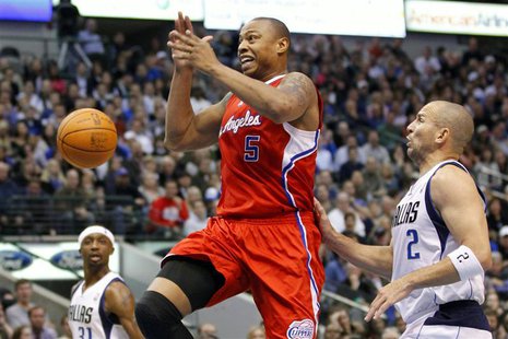 Los Angeles Clippers forward Caron Butler (C) looses the ball as he drives the lane on Dallas Mavericks guard Jason Kidd (R) while guard Jas Los Angeles Clippers forward Caron Butler (C) looses the ball as he drives the lane on Dallas Mavericks guard Jason Kidd (R) while guard Jas