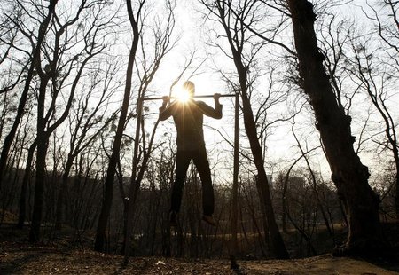 A man does chin-ups at a city park in Kiev, March 19, 2012. REUTERS/Anatolii Stepanov A man does chin-ups at a city park in Kiev, March 19, 2012. REUTERS/Anatolii Stepanov