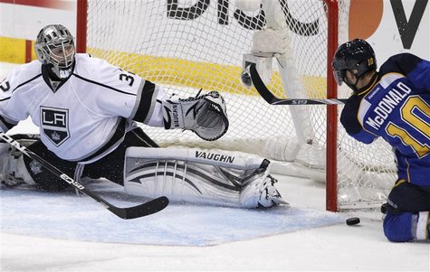 Los Angeles Kings goalie Jonathan Quick (32) makes a save on St. Louis Blues center Andy McDonald (10) in the 3rd period during Game 2 of th Los Angeles Kings goalie Jonathan Quick (32) makes a save on St. Louis Blues center Andy McDonald (10) in the 3rd period during Game 2 of th