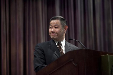 New York City Comptroller and 2013 Mayoral candidate John Liu smiles as he stands at the podium during an event at Medgar Evers College in B New York City Comptroller and 2013 Mayoral candidate John Liu smiles as he stands at the podium during an event at Medgar Evers College in B