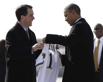 Wisconsin Governor Scott Walker (L) presents U.S. President Barack Obama with a Milwaukee Brewers jersey upon his arrival in Milwaukee, Wisc Wisconsin Governor Scott Walker (L) presents U.S. President Barack Obama with a Milwaukee Brewers jersey upon his arrival in Milwaukee, Wisc