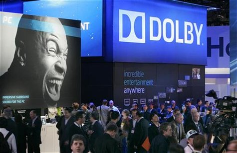 Show-goers pass by the Dolby booth during the 2010 International Consumer Electronics Show (CES) in Las Vegas, Nevada January 7, 2010. REUTE Show-goers pass by the Dolby booth during the 2010 International Consumer Electronics Show (CES) in Las Vegas, Nevada January 7, 2010. REUTE