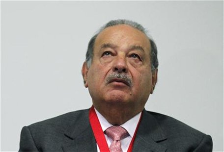Businessman Carlos Slim looks on after receiving the Medal of Honour and Merit of the Mexican Red Cross from the President of International Businessman Carlos Slim looks on after receiving the Medal of Honour and Merit of the Mexican Red Cross from the President of International