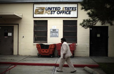 Betty Terry walks past a post office which closed its counter services four years ago at the Veterans Administration in Los Angeles, Califor Betty Terry walks past a post office which closed its counter services four years ago at the Veterans Administration in Los Angeles, Califor