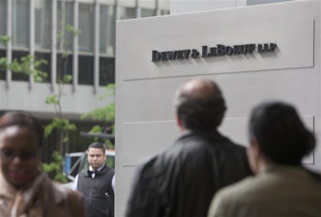 People walk past a sign outside the law firm Dewey & LeBoeuf in New York City May 1, 2012. REUTERS/Lee Celano People walk past a sign outside the law firm Dewey & LeBoeuf in New York City May 1, 2012. REUTERS/Lee Celano