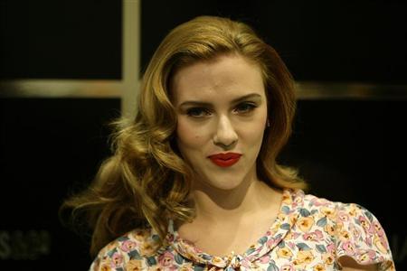 U.S. actress Scarlett Johansson poses for photographers at Selfridges department store in Oxford Street where she made a promotional appearance, in central London July 31, 2009.
Credit: Reuters/Stefan Wermuth U.S. actress Scarlett Johansson poses for photographers at Selfridges department store in Oxford Street where she made a promotional appearance, in central London July 31, 2009.
Credit: Reuters/Stefan Wermuth