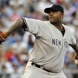 New York Yankees starting pitcher CC Sabathia delivers a first inning pitch against the Kansas City Royals during their MLB American League 