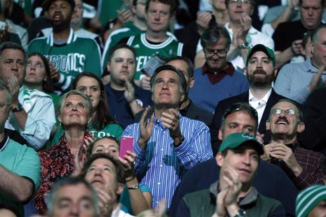 Republican presidential candidate and former Massachusetts Governor Mitt Romney (C), with his wife Ann at his side, applauds before Game 4 o Republican presidential candidate and former Massachusetts Governor Mitt Romney (C), with his wife Ann at his side, applauds before Game 4 o