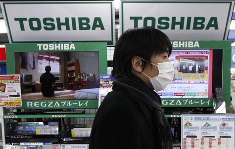A man walks past Toshiba Corp's Regza liquid-crystal display (LCD) televisions at an electronic store in Tokyo January 31, 2012. REUTERS/Tor A man walks past Toshiba Corp's Regza liquid-crystal display (LCD) televisions at an electronic store in Tokyo January 31, 2012. REUTERS/Tor