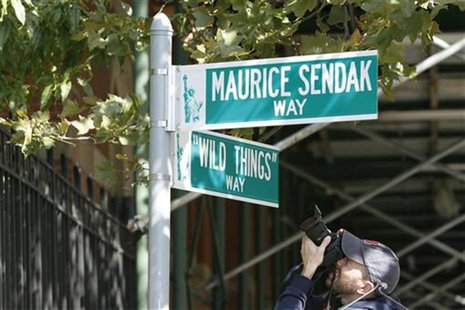 A photographer takes pictures of a street sign commemorating the area where author Maurice Sendak wrote the book "Where The Wild Things Are" A photographer takes pictures of a street sign commemorating the area where author Maurice Sendak wrote the book "Where The Wild Things Are"
