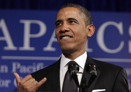 U.S. President Barack Obama gestures shaka at the Asian Pacific American Institute for Congressional Studies (APAICS) 18th annual gala dinne U.S. President Barack Obama gestures shaka at the Asian Pacific American Institute for Congressional Studies (APAICS) 18th annual gala dinne