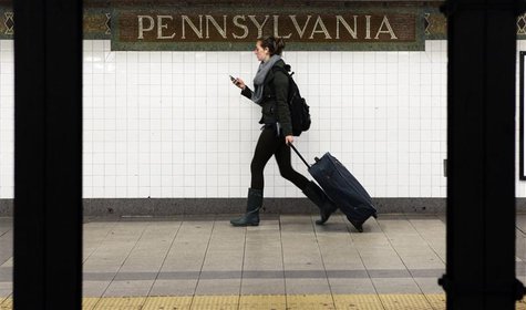 A woman wheels luggage along the subway platform at the 34th Street Penn Station stop in New York November 23, 2011. REUTERS/Shannon Staplet A woman wheels luggage along the subway platform at the 34th Street Penn Station stop in New York November 23, 2011. REUTERS/Shannon Staplet