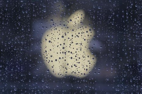 Raindrops are seen in front of an Apple logo outside an Apple store in Shanghai February 22, 2012. REUTERS/Aly Song Raindrops are seen in front of an Apple logo outside an Apple store in Shanghai February 22, 2012. REUTERS/Aly Song