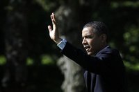 U.S. President Barack Obama waves as he walks out from the Oval Office of the White House in Washington May 10, 2012, before his departure t