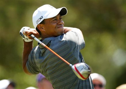 Tiger Woods watches his tee shot on the ninth hole during the first round of the Players Championship PGA golf tournament at TPC Sawgrass in Tiger Woods watches his tee shot on the ninth hole during the first round of the Players Championship PGA golf tournament at TPC Sawgrass in