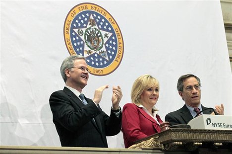 The Governor of Oklahoma, Mary Fallin (C) rings the opening bell at New York Stock Exchange with Jeffrey Eubank, (L) NYSE Vice President for The Governor of Oklahoma, Mary Fallin (C) rings the opening bell at New York Stock Exchange with Jeffrey Eubank, (L) NYSE Vice President for
