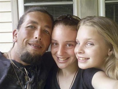 Adam Mayes (L) is shown with Adrienne and Alexandria Bain (R) in this undated handout photo released to Reuters by the Tennessee Bureau of I Adam Mayes (L) is shown with Adrienne and Alexandria Bain (R) in this undated handout photo released to Reuters by the Tennessee Bureau of I