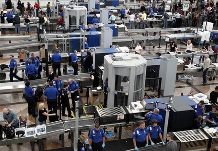 Transportation Security Agency (TSA) workers carry out security checks at Denver International Airport, the day before the Thanksgiving holi Transportation Security Agency (TSA) workers carry out security checks at Denver International Airport, the day before the Thanksgiving holi