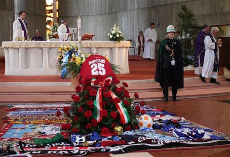 The coffin of Livorno's soccer player Piermario Morosini is seen during his funeral in Bergamo April 19, 2012. REUTERS/ANSA/Pool The coffin of Livorno's soccer player Piermario Morosini is seen during his funeral in Bergamo April 19, 2012. REUTERS/ANSA/Pool