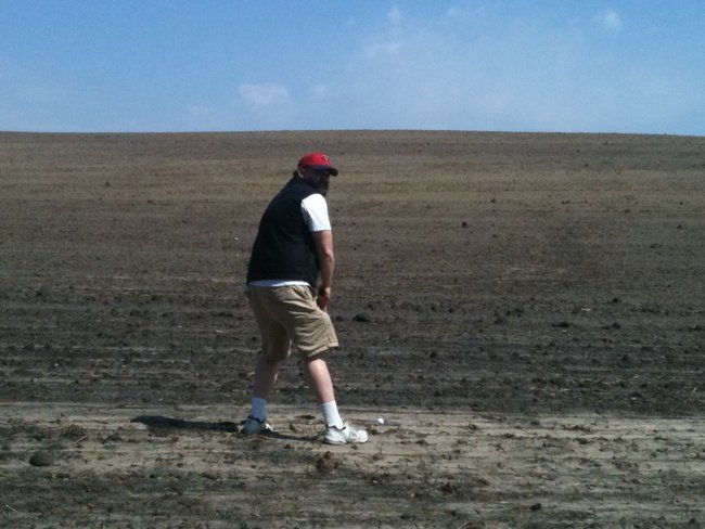 One of the nicest courses we've ever played.  okay, this was the farm field next to said course...which Justin seemed to find often.