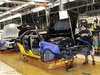 A General Motors assembly worker works on the production line for the 2011 Cadillac at the Grand River Assembly plant in Lansing, Michigan O