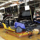 A General Motors assembly worker works on the production line for the 2011 Cadillac at the Grand River Assembly plant in Lansing, Michigan O A General Motors assembly worker works on the production line for the 2011 Cadillac at the Grand River Assembly plant in Lansing, Michigan O