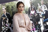 Cast member Jennifer Lopez poses at the premiere of "What to Expect When You're Expecting" at Grauman's Chinese Theatre in Hollywood, Califo