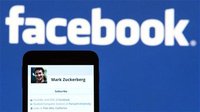 The Facebook profile of founder Mark Zuckerberg on a mobile phone is seen in this photo illustration taken in Lavigny May 16, 2012. Facebook