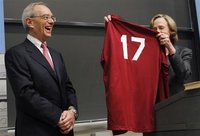 Massachusetts Institute of Technology President Susan Hockfield (R) presents MIT President-elect L. Rafael Reif with an MIT jersey with the 