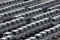 Newly produced trucks are seen at an industrial port before they are loaded to a cargo ship in Yokohama, south of Tokyo May 17, 2012. REUTER