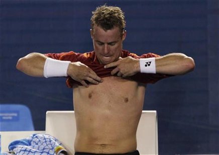 Lleyton Hewitt of Australia changes his shirt during a break in between games during his match against Novak Djokovic of Serbia at the Austr Lleyton Hewitt of Australia changes his shirt during a break in between games during his match against Novak Djokovic of Serbia at the Austr