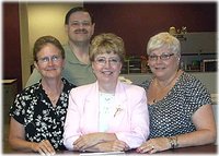 Julie Glancey, (center), announces she's stepping down as County Clerk after 17 years.  Dave Wehrwin (back), to seek post.