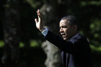 U.S. President Barack Obama waves as he walks out from the Oval Office of the White House in Washington May 10, 2012, before his departure t
