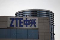 Employees of ZTE chat on the roof of its headquarters in Shenzhen, Guangdong province, April 17, 2012. REUTERS/Tyrone Siu