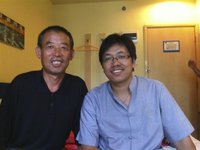 A handout photo shows Chen Guangfu (L), elder brother of blind activist Chen Guangcheng and father of Chen Kegui, posing with Guo Yushan (R)