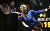 Serena Williams of the U.S. returns the ball to Galina Voskoboeva of Kazakhstan during their match at the Rome Masters tennis tournament May