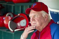 Philadelphia Phillies manager Charlie Manuel sits in the dugout prior to their their MLB spring training game against the Detroit Tigers in 