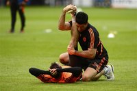 Chelsea's Frank Lampard gets his leg streched during a practice session in Munich May 18, 2012. Chelsea will face Bayern Munich in the Champ