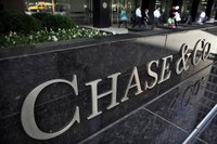 People exit the lobby of JPMorgan Chase & Co. headquarters in New York, May 17, 2012. REUTERS/Eduardo Munoz