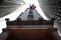 The U.S. flag hangs outside the New York Stock Exchange November 9, 2011. REUTERS/Brendan McDermid