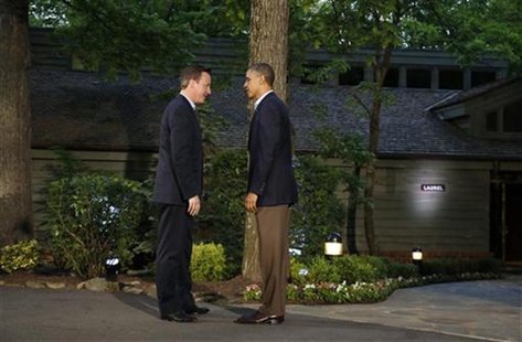 U.S. President Barack Obama (R) greets Britain's Prime Minister David Cameron as he arrives at the G8 Summit at Camp David, Maryland May 18, U.S. President Barack Obama (R) greets Britain's Prime Minister David Cameron as he arrives at the G8 Summit at Camp David, Maryland May 18,