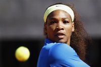 Serena Williams of U.S. returns the ball to Anabel Medina Garrigues of Spain during their match at the Rome Masters tennis tournament May 17