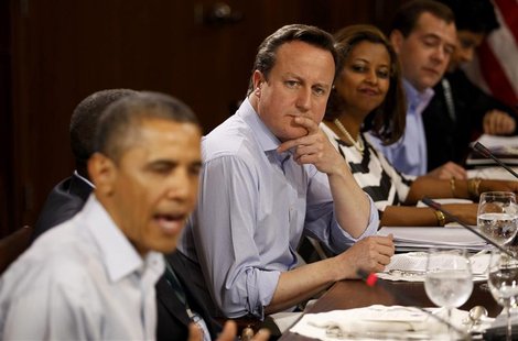 Britain's Prime Minister David Cameron listens as U.S. President Barack Obama (L) speaks during an expanded G8 working luncheon with leaders Britain's Prime Minister David Cameron listens as U.S. President Barack Obama (L) speaks during an expanded G8 working luncheon with leaders