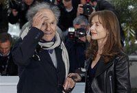 Cast members Isabelle Huppert (R) and Jean-Louis Trintignant pose during a photocall for the film "Amour", by director Michael Haneke, in co